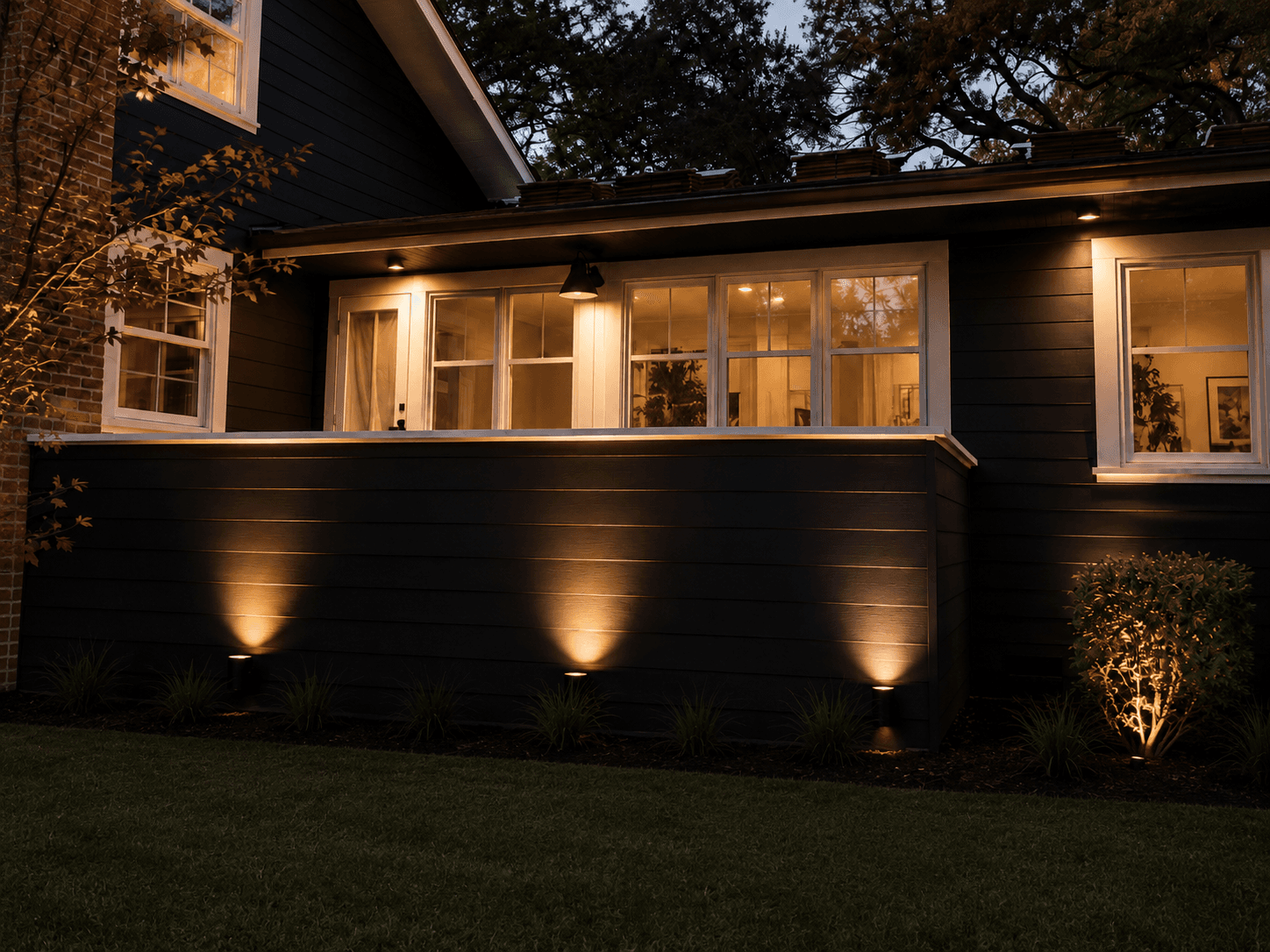 JM Core Innovations exterior renovation detail with warm architectural lighting